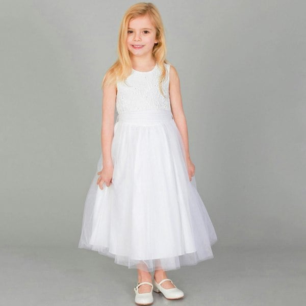 Girl wearing a white party dress and shoes