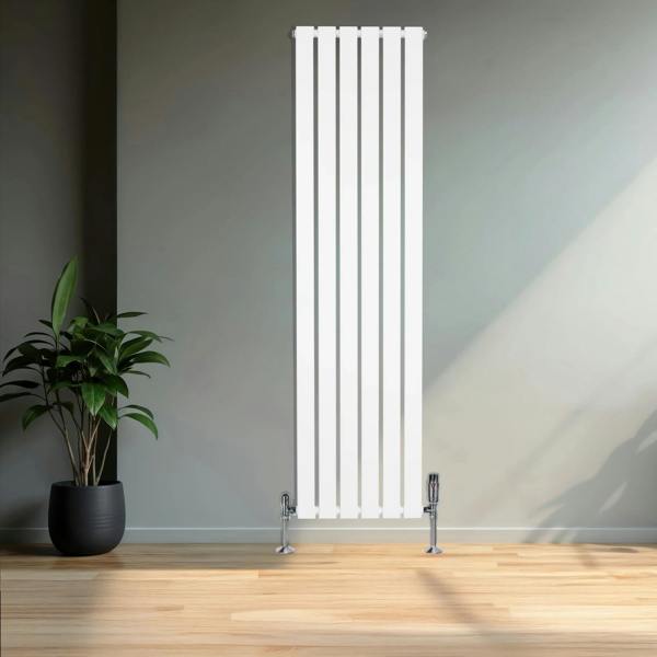 Flat white single column radiator with sleek vertical design, chrome valves, and modern aesthetic, set against a minimalist wall and plant