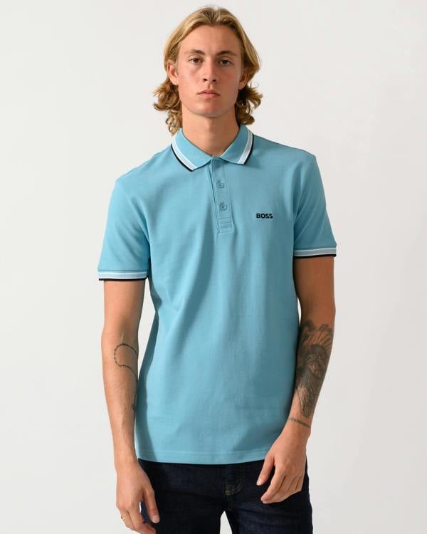 studio photograph of a model wearing a BOSS Green Paddy Mens Cotton-Piqué Polo Shirt with Contrast Logo in Open Blue 486
