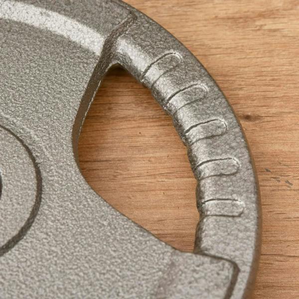 Cast iron weight plate with curved grip cutout on edge, speckled gray