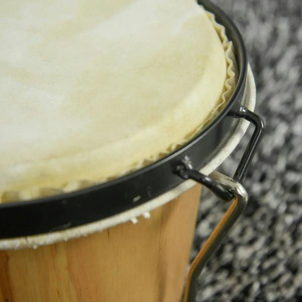 Close-up of a natural drumhead on a natural wood bongo with black metal frame