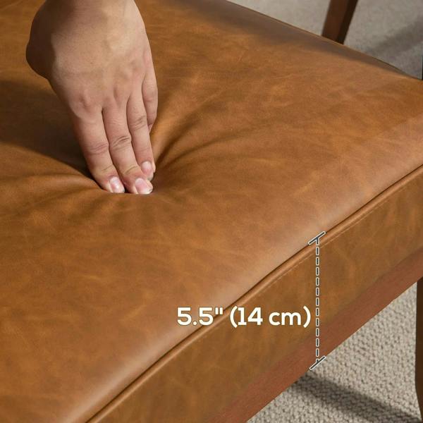 Brown faux leather seat cushion with seam stitching and rounded piping edge.
