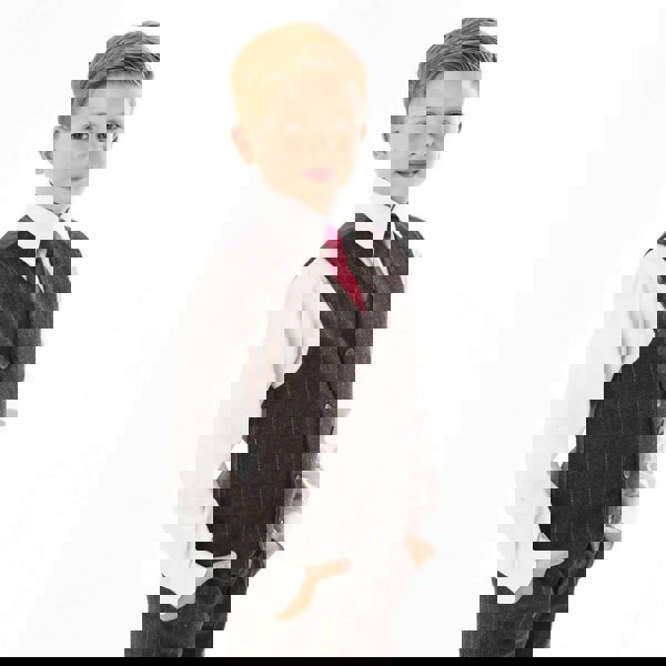 Boy wearing a grey checked waistcoat and burgundy tie