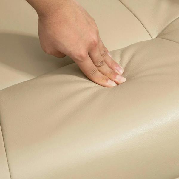 Cream white PU leather seat cushion with hand smoothing the upholstery