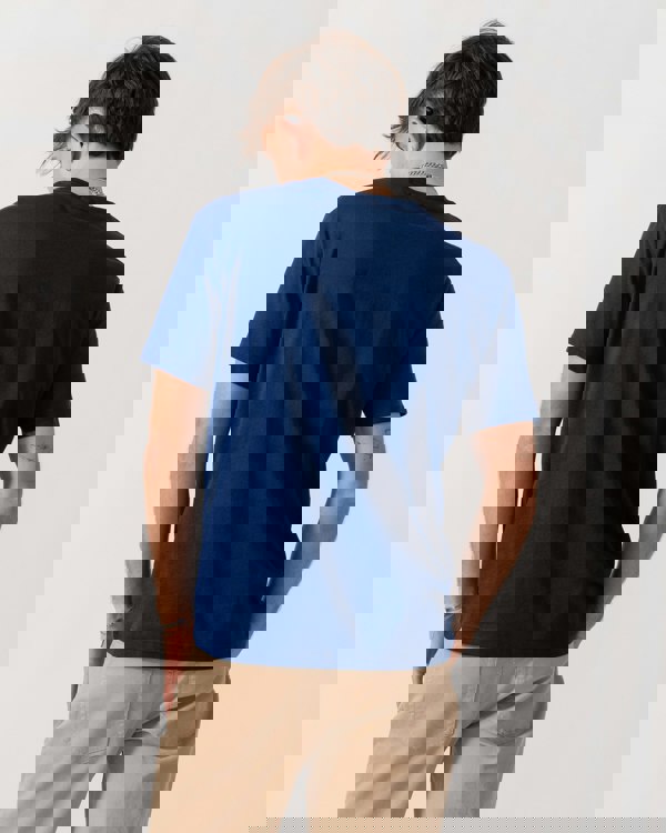 back shot of a model wearing a GANT Mens Regular Fit Short Sleeve Shield Logo T-Shirt in Rich Navy