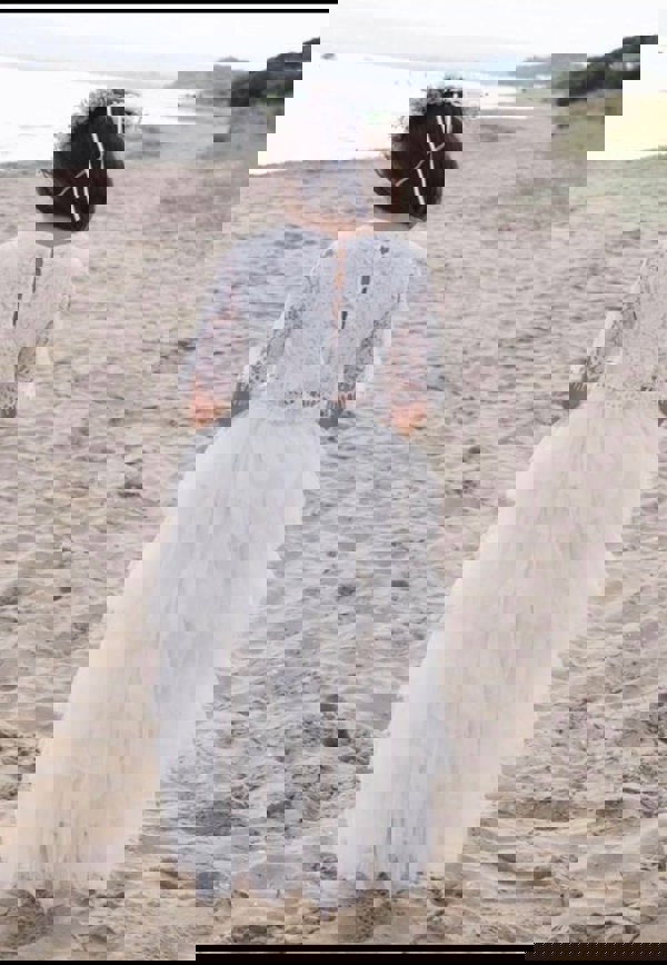young flower girl on beach