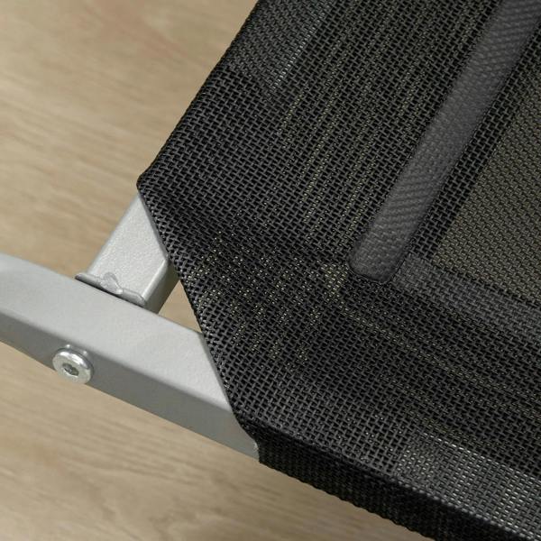 Close-up of black breathable mesh on a raised dog cot with steel side supports