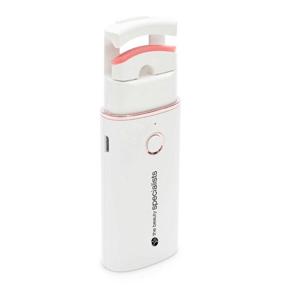 The Rio WOW Lash Heated Eyelash Curler is a compact, white handheld device with a pink curved pad and front button. Its modern design and small charging port let you curl your lashes easily and beautifully.