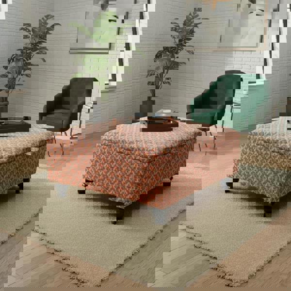 Versatile square storage ottoman used as footrest and seating