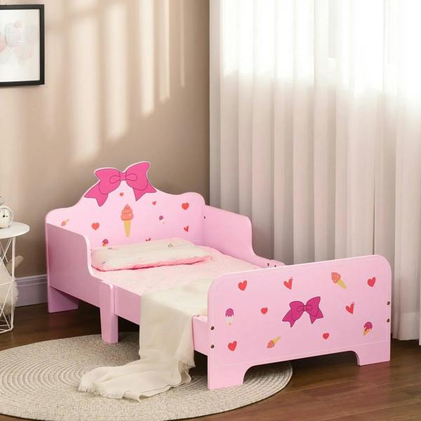 Pink kids toddler bed with princess bow headboard and heart-and-ice-cream side panels, safety rails