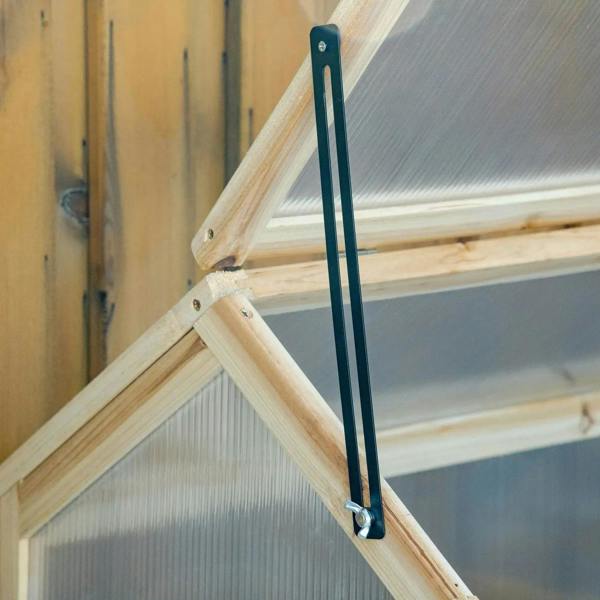 Open lid support bar on wooden cold frame greenhouse with clear polycarbonate roof