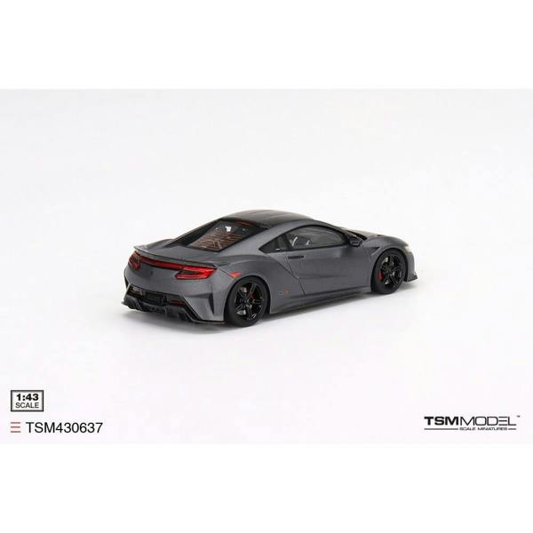 a grey sports car on a white background