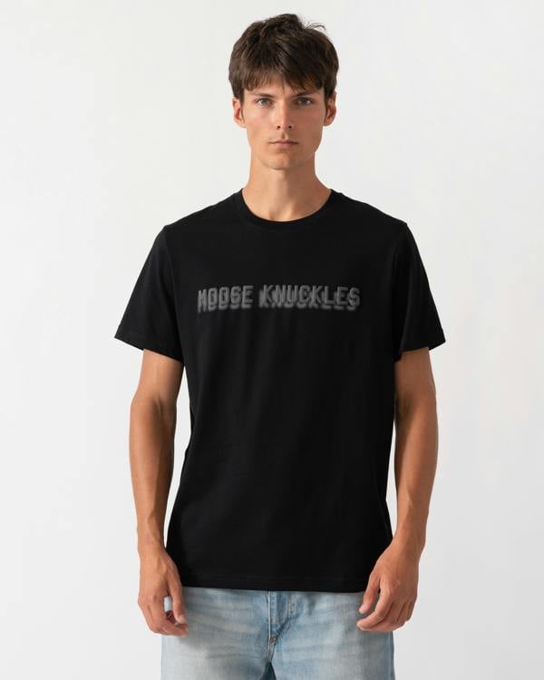 model wearing a Moose Knuckles Mens Shadow Logo T-Shirt in Black 292