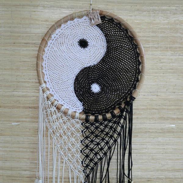 Extra large yin-yang dream catcher top view: black and white circular webs on bamboo frame
