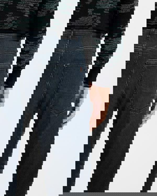 Model wearing BOSS Orange ReMaine Mens Jeans 50555289 in Dark Blue 408 - close up