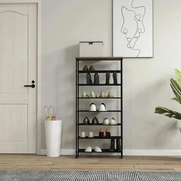 Black freestanding shoe rack with mesh shelves, holds multiple pairs