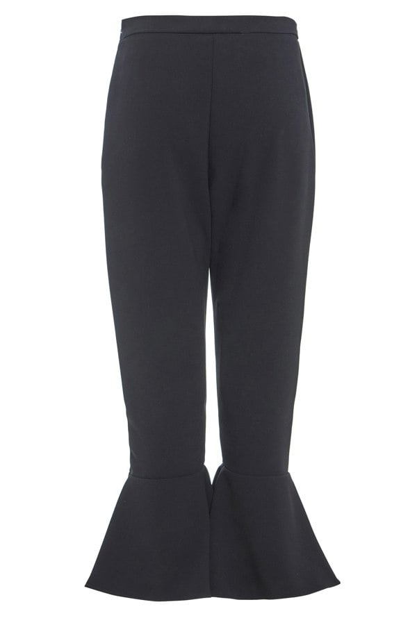 A woman's Sarvin Black Frill Hem Trousers.