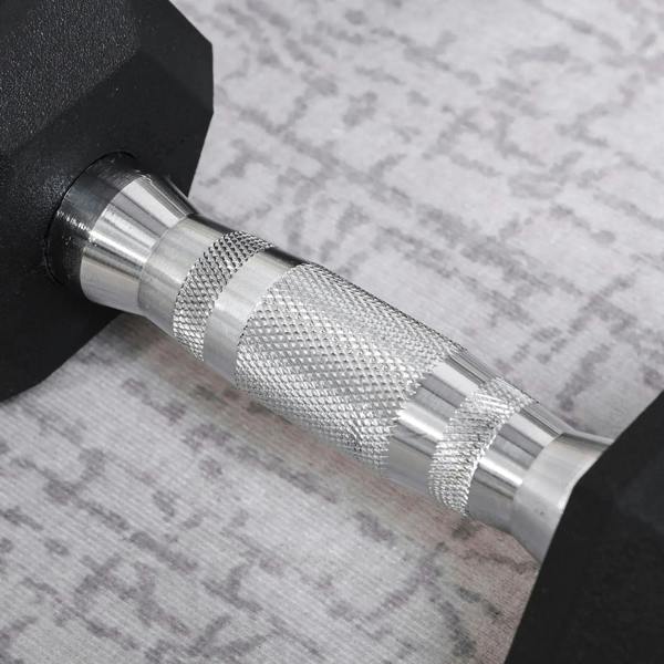Close-up of black hex rubber dumbbell with chrome knurled grip and rubber texture