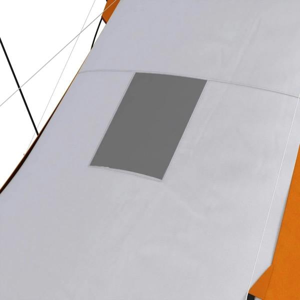 White tent floor panel with rectangular vent window near orange side wall