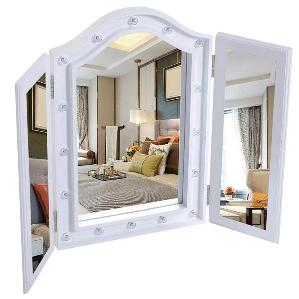 White tri-fold tabletop mirror with arched center glass and two side panels, open display
