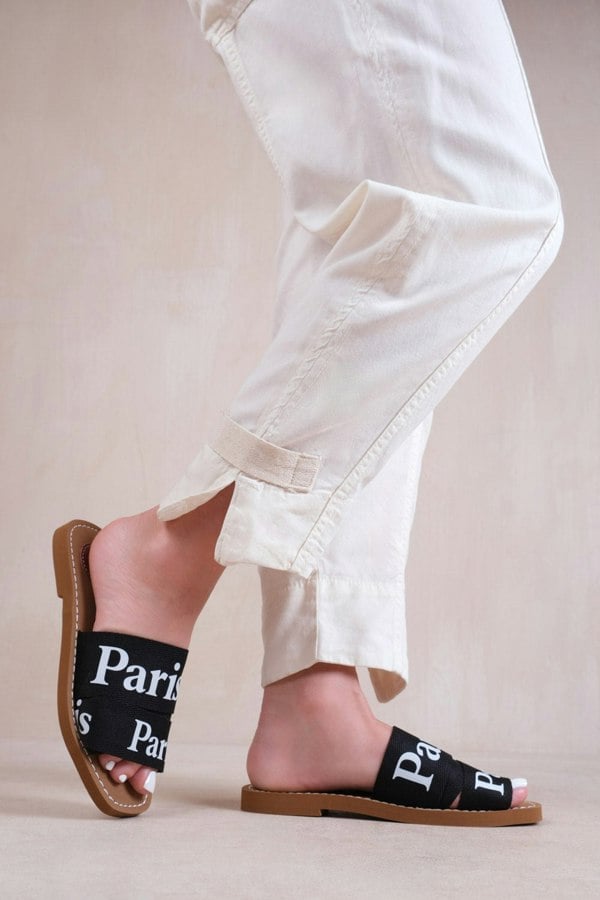 Where's That From Bella Flat Sandals With Cross Over Band in Black Faux Leather