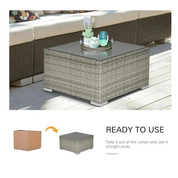 Square wicker rattan coffee table with grey glass top and light grey woven sides, metal base feet