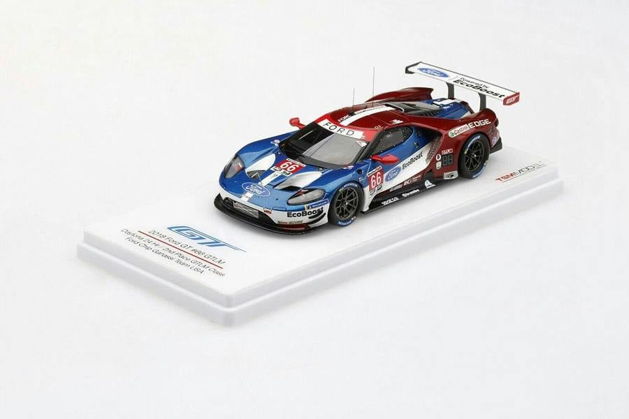 a toy car on a white surface