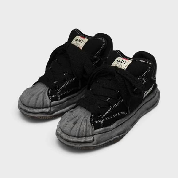 Supplied Fashion Maison Mihara Yasuhiro Blakey Puffer black canvas low-top sneakers with signature distressed OG sole