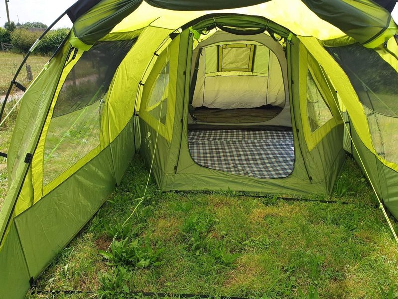 An image of the Abberley XL Tunnel tent with the extension attached, showing the view inside from the front entrance looking inside the tent.