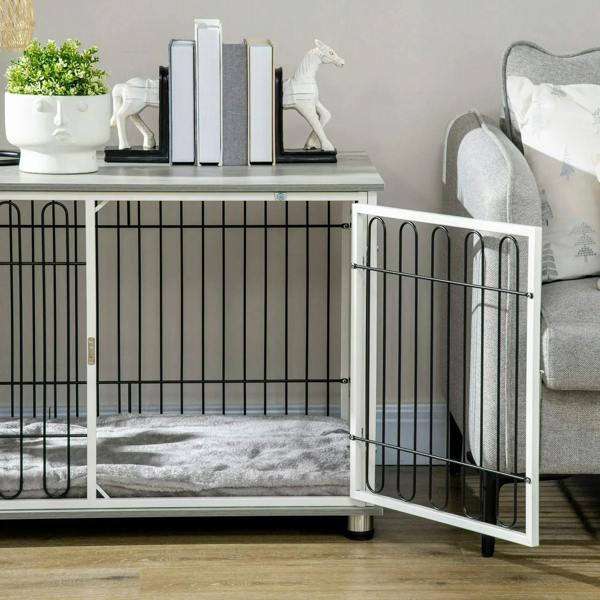 Indoor dog crate end table with open door, grey cushion inside, black bar front