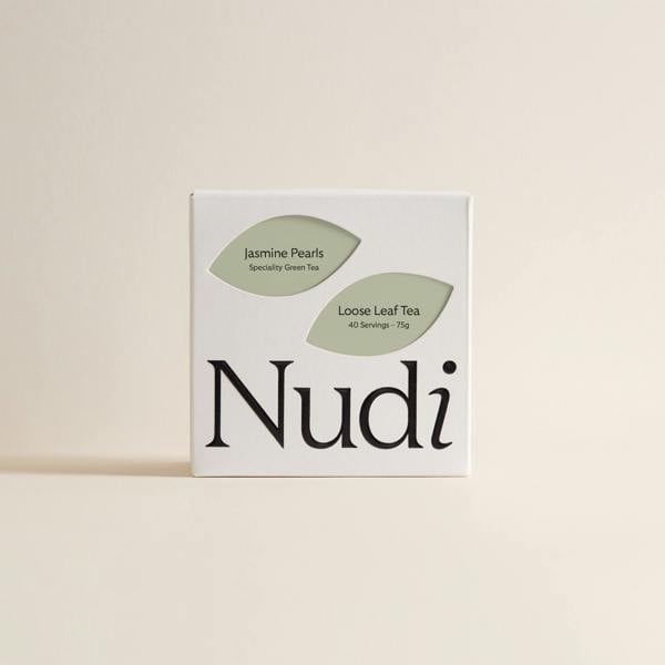 Nuditea jasmine pearls luxury tea box with green and olive green leaves on white packaging.