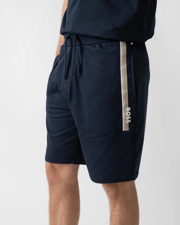 close up of a model wearing a BOSS Orange Authentic Mens Loungewear Shorts with Stripe and Logo in Dark Blue 405