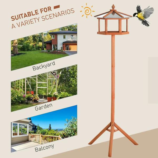 Wooden bird feeding table on tall tripod stand with small gazebo roof, natural wood.