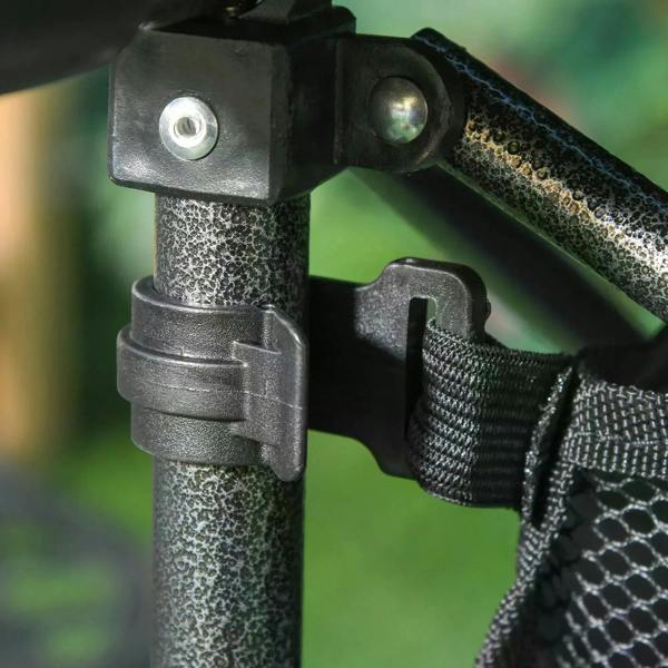 Close-up of black folding table hardware with strap and latch on leg frame.