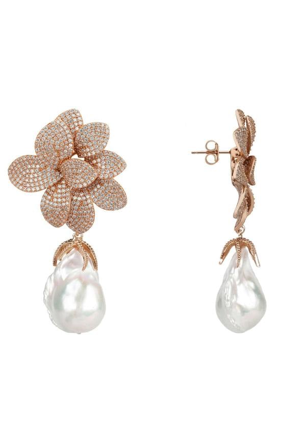 Rose gold flower-shaped earrings with pearl drops on a white background
