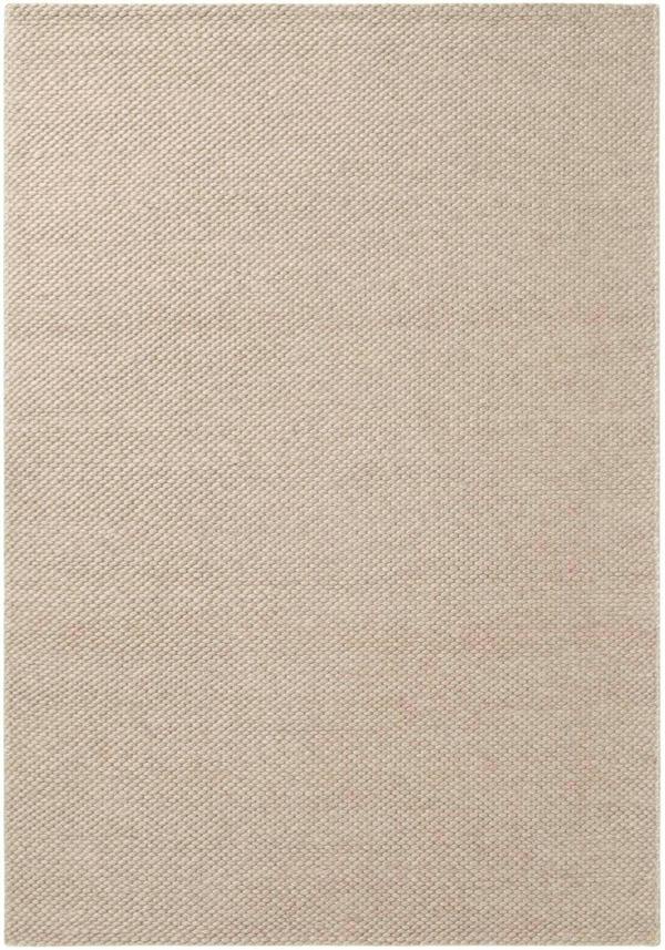 Beige area rug with a subtle pattern
