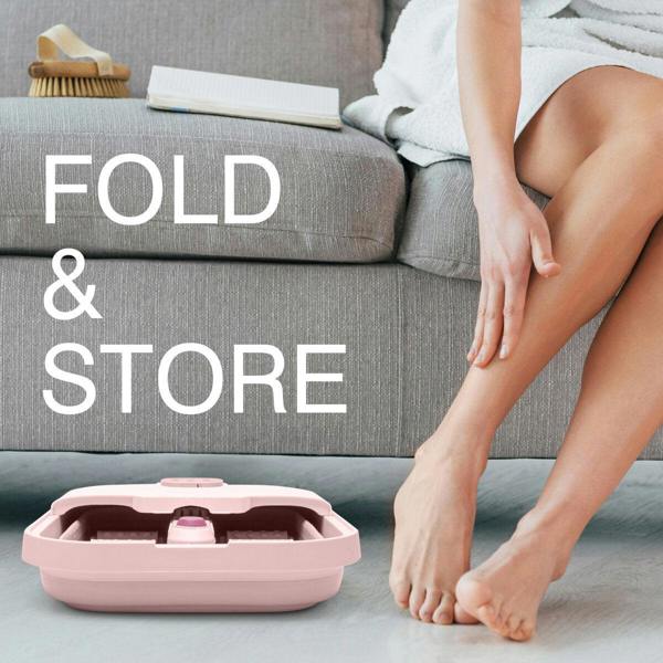 A person relaxes on a grey sofa, a Rio Deluxe Foldaway Foot Spa Bath in pink beside them, hinting at a luxurious foot treatment. The words FOLD & STORE appear on the image.