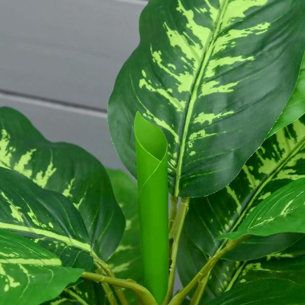 Faux rose plant with pots, close-up green leaves with light speckling and stems