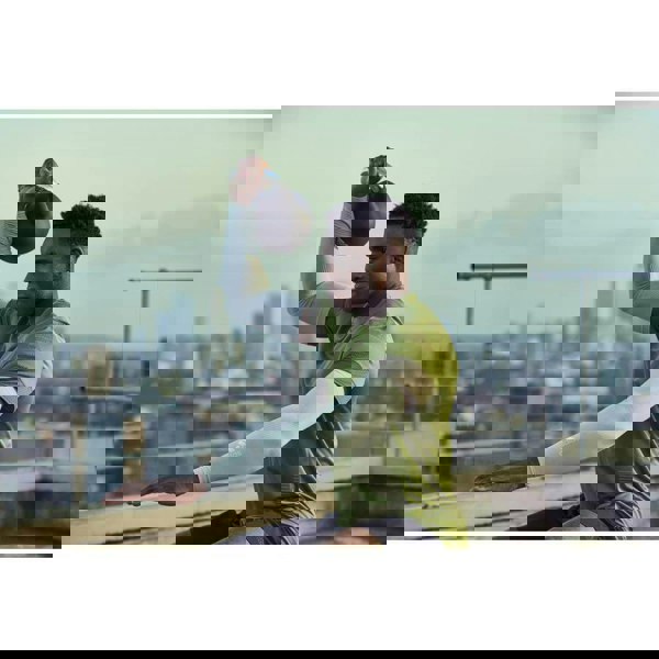 Man performing functional training with an Adidas 16kg Cast Iron Kettlebell 