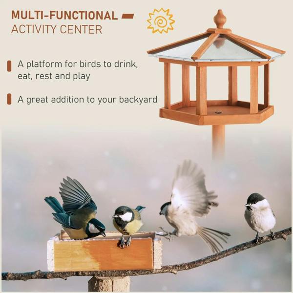 Wooden bird feeding table gazebo with roof on tall stand, natural wood; birds nearby.