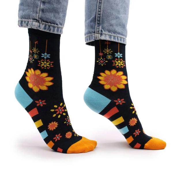 Black crew socks with colorful flower mandala prints, light blue heel and toe