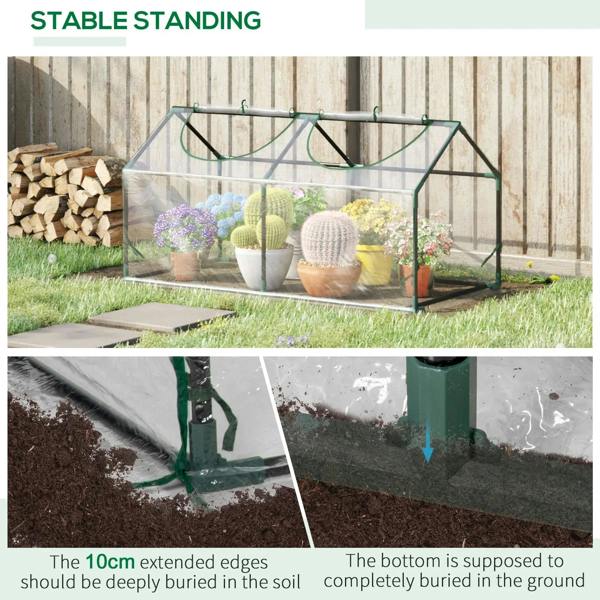 Clear mini greenhouse with green frame and zipped windows with potted plants inside