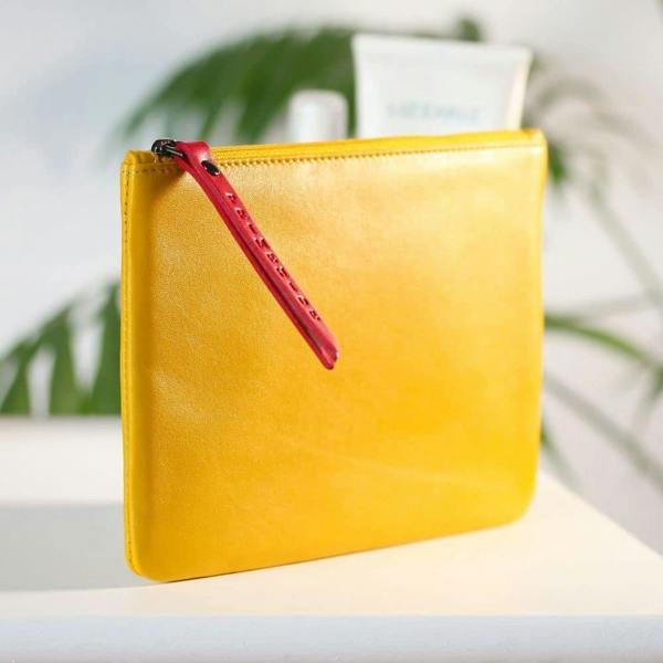 Slim soft yellow leather makeup pouch – side profile