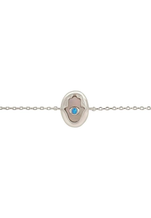 Silver bracelet with a blue gemstone on a white background