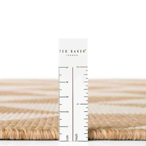 Measurement ruler with 'Ted Baker London' branding on a white background