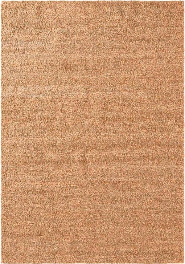 Beige area rug with a textured pattern