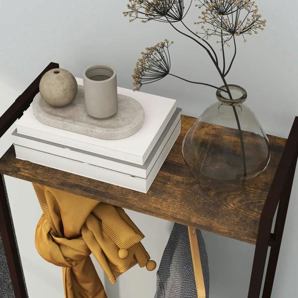 Rustic brown top shelf on compact clothes rail with decorative items