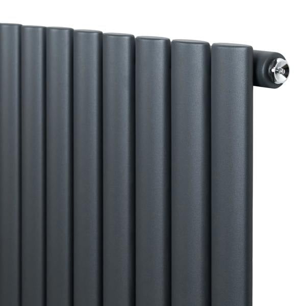 Oval single column radiator in anthracite grey, featuring a sleek, modern design with rounded edges and a smooth matte finish