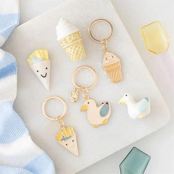 Seagull and chips keyring display with gold-tone charms, including ice-cream and seagull