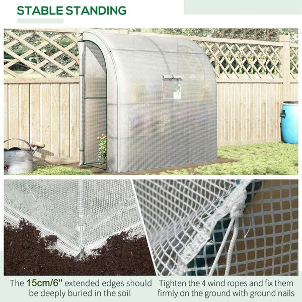 White greenhouse tunnel with mesh cover, grounded corner ropes, and reinforced base edges
